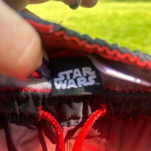 Star Wars boys swim trunks sz10/12 NWOT, never worn millennial falcon red